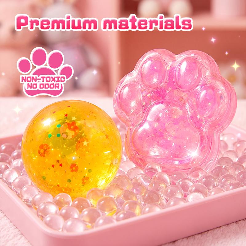 Close-up of colorful ball and paw-shaped squishy craft creations