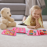 Child playing with the pink busy board activity book at home