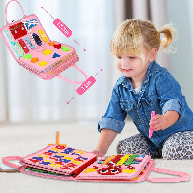 Child exploring the pink busy board activity book and its matching activities