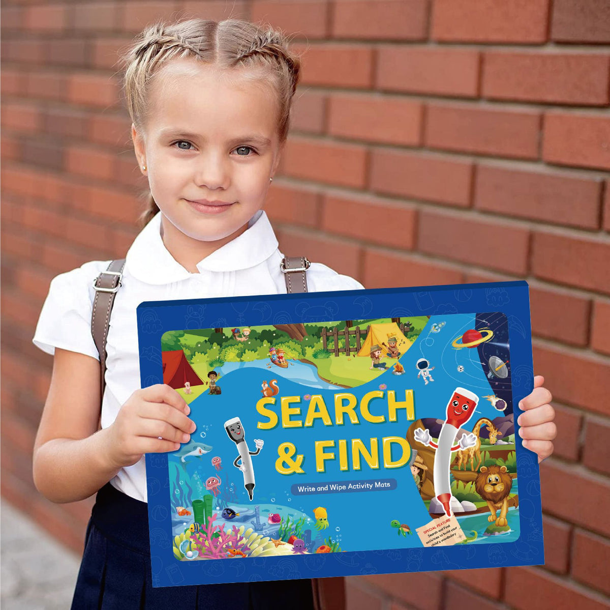Search and Find Mats — child holding the activity set box